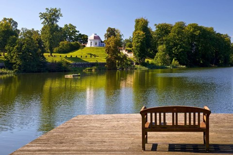 Footbridge with bench to Huwenowsee at Meseberg Castle Park, guest house and conference venue of