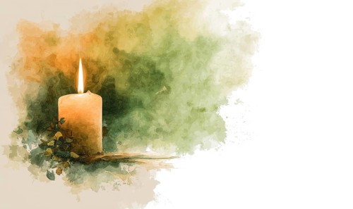 A candle is lit on a table with a green background. The candle is the main focus of the image, and