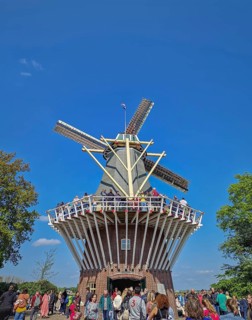 Lisse, Holland, Netherlands, April 25, 2025: the iconic brick windmill at Keukenhof, set against a