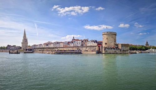 The entrance to the Vieux Port of La Rochelle, France. Panoramic view of all the medieval landmarks