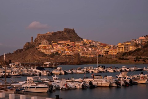 CASTELSARDO, ITALY - AUGUST 20, 2017: Aerial view of boats in port and city Castelsardo, one of the