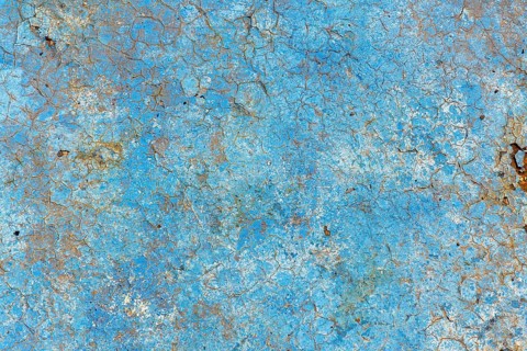 Light blue rusty vintage paint background, color on old pool bottom, brown, yellow, decay texture,
