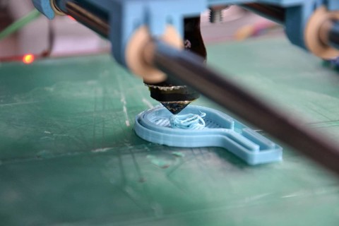 Modular 3d printer prints fully functional blue whistle, green pad
