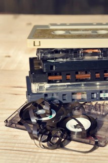 Old broken unwound compact cassette audio tape messed up