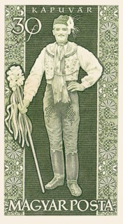 An old vintage Hungarian postage stamp depicting a man in traditional clothing from the town of