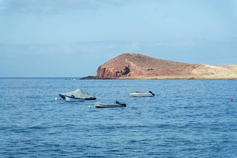 Dramatic cliffs around Montana Bocinegro and Montana Roja mountain, Tenerife coast near El Medano,