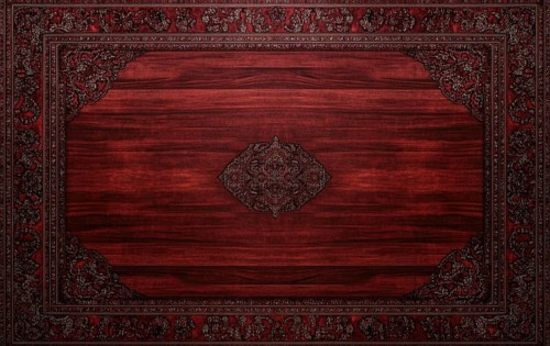 A wooden table with a red rug underneath it. The rug has a design on it. The table is empty AI