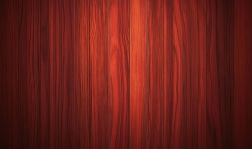 A close up of a wooden surface with a reddish brown color. The wood grain is visible and the