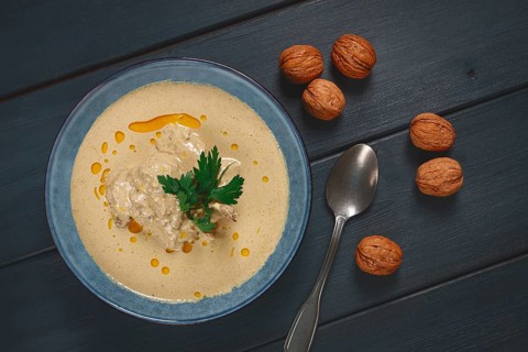 Satsivi, Georgian dish, chicken in nut sauce, cold appetizer, on a wooden table, no people,