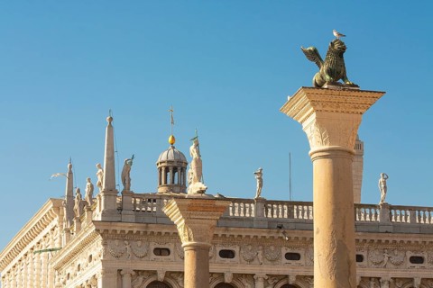 Columns of San Marco and Saint Theodor and detail of library Marchiala on San Marco square, Venice,