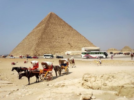 The Great Pyramid of Giza, nestled in the sands of the Sahara Desert, features a pharaonic