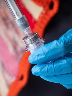 Istambul, Turkey October 21st 2025 Nurse hand in blue glove holding Sandostatin injection,