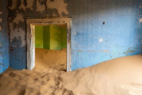 Building taken over by desert sand, in a former diamond town, today a ghost town, Lost Place,