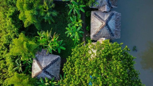 Nature resort next to a river in Vietnam, Asia, seen from above