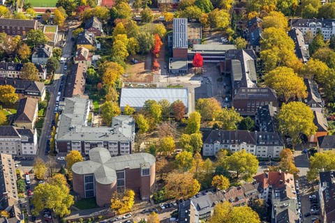 Aerial view, Maria-Wächtler-Gymnasium, below catholic church of St. Andreas, autumn trees,