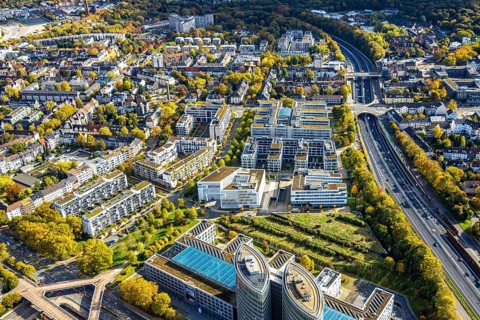Aerial view, Messeallee office building, A52 motorway, autumn trees and tree-lined avenue,