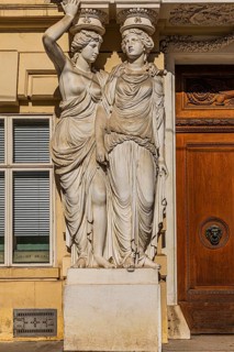 Women as supporting marble statues at a historic building, Josefsplatz, Vienna, Austria