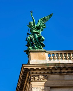 A bronze angel on the roof of the Kunsthistorisches Museum on Maria-Theresien-Platz, Vienna,