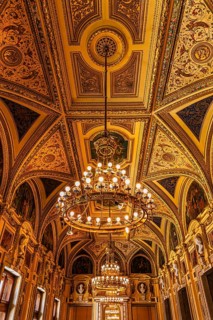 Sumptuous room and chandelier in the Vienna State Opera, Vienna, Austria