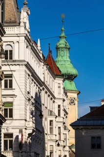 Historic facades and church with onion tower, near Neumarkt, Vienna, Austria
