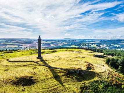 Waterloo Monument over Scottish fields and farms from a drone, Jedburgh, Scotland, UK