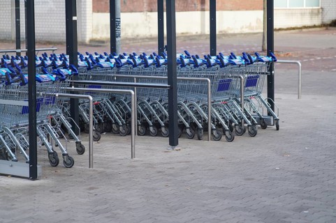 Borken, NRW, Germany, REmpty shopping carts neatly arranged in rows under a shelter in a parking