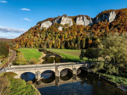 Aerial view of the Upper Danube Valley surrounded by autumn vegetation with the Hausender Peaks
