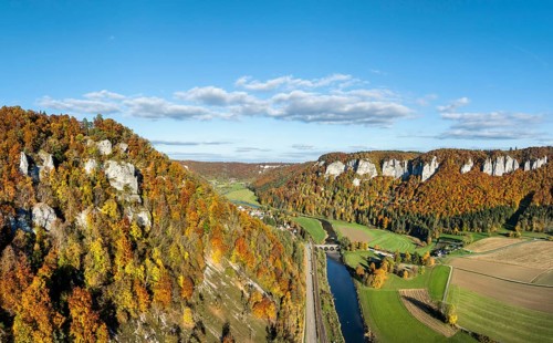 Aerial view, panorama of the Upper Danube Valley, surrounded by autumn vegetation with the
