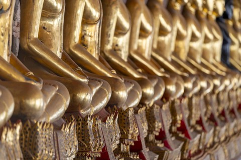Gilded Buddha statues (Bhumispara mudra: Buddha Gautama at the moment of enlightenment), Wat Suthat