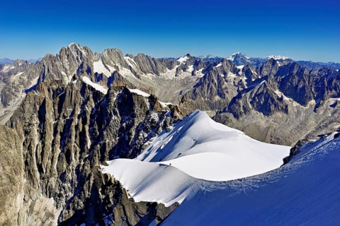 View from the Aiguille du Midi mountain station observation deck of the mountains Aiguille Vert,