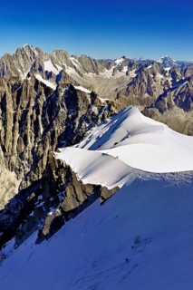 View from the Aiguille du Midi mountain station observation deck of the mountains Aiguille Vert,