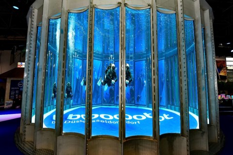 Diving tower with divers, logo lettering boot Düsseldorf on the ground in exhibition hall 12 of