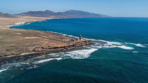 Aerial view of in the center lighthouse Faro Punta de Jandia at the southern tip of Jandia