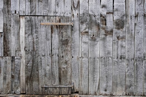 Wooden door with metal fittings in an old wooden barn, Borken-Weseke, Münsterland, North