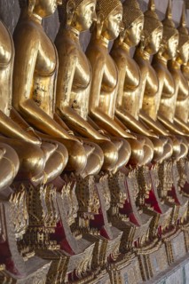 Gilded Buddha statues (Bhumispara mudra: Buddha Gautama at the moment of enlightenment), Wat Suthat