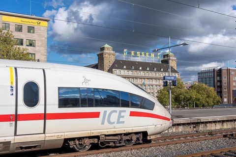 ICE train on track 2 in Essen main station, view of the city center, Handelshof building with Essen