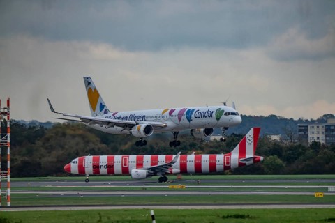 Condor aircraft landing and waiting for takeoff at Düsseldorf Airport, North Rhine-Westphalia,