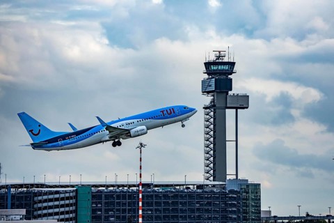 TUI Fly Boeing 737-800 taking off from Düsseldorf Airport, Air Traffic Control Tower, North