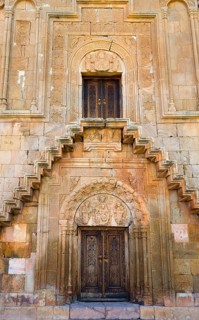 Elaborately designed façade with stairs and ornately decorated doors, Noravank monastery, Surb