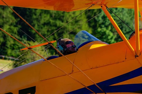 A biplane Bücker Bü 131 Jungmann with registration SP-YPZ during a flight demonstration as part of