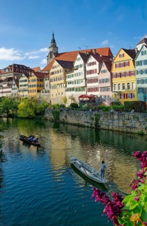 Historic houses on the Neckar front, the Neckar river with poking and water reflection, old town of