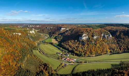 Aerial view, panorama, Upper Danube Valley, surrounded by autumn vegetation, on the horizon
