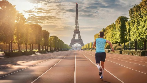 A runner on a track near the Eiffel Tower in Paris, capturing the spirit of the 2024 Olympic Games
