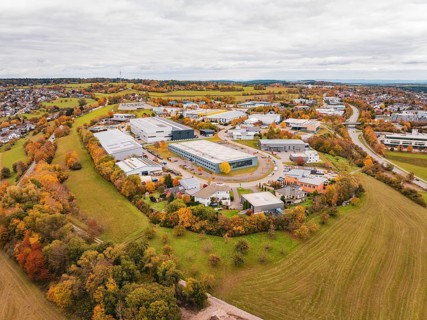 Bird's eye view of industrial buildings and fields in autumn weather, Dornstetten, Freudenstadt