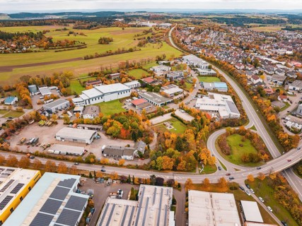 Aerial view of a city with industrial buildings, roads and autumn landscape, Dornstetten,