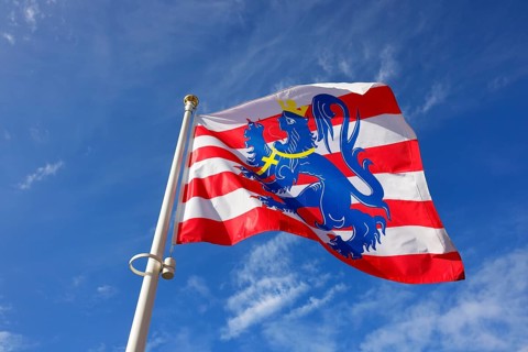Flag of the city of Bruges fluttering in the wind, Bruges, Flanders, Belgium