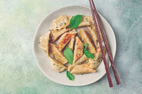 Japanese fried dumplings, gyoza, sesame seeds, top view, no people