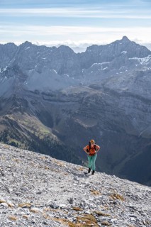 Female hiker on steep rocky slope, hiking to Gamsjoch, eastern Karwendel, Tyrol, Austria