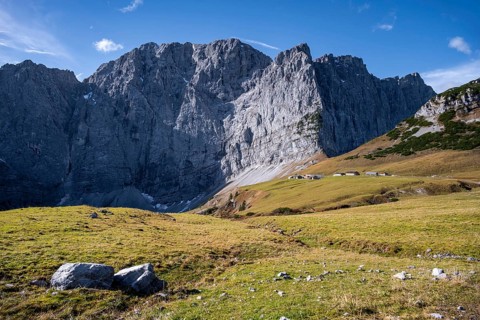 Dreizinkenspitze and Laliederer Wand, large rock face with meadows in the foreground under blue