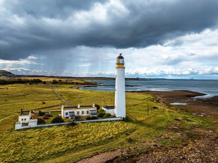 Rain Clouds over Barns Ness Lighthouse from a drone, Dunbar, East Lothian, Scotland, UK